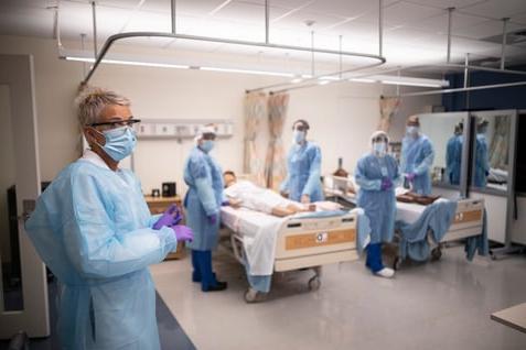 Students and instructor in Sim Lab in PPE